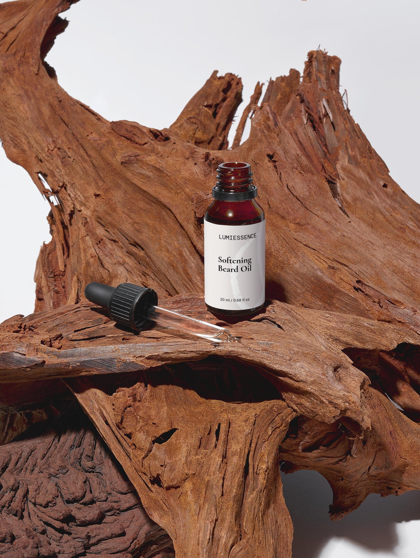 Barbershop counter with Softening Beard Oil as part of a complete grooming set.