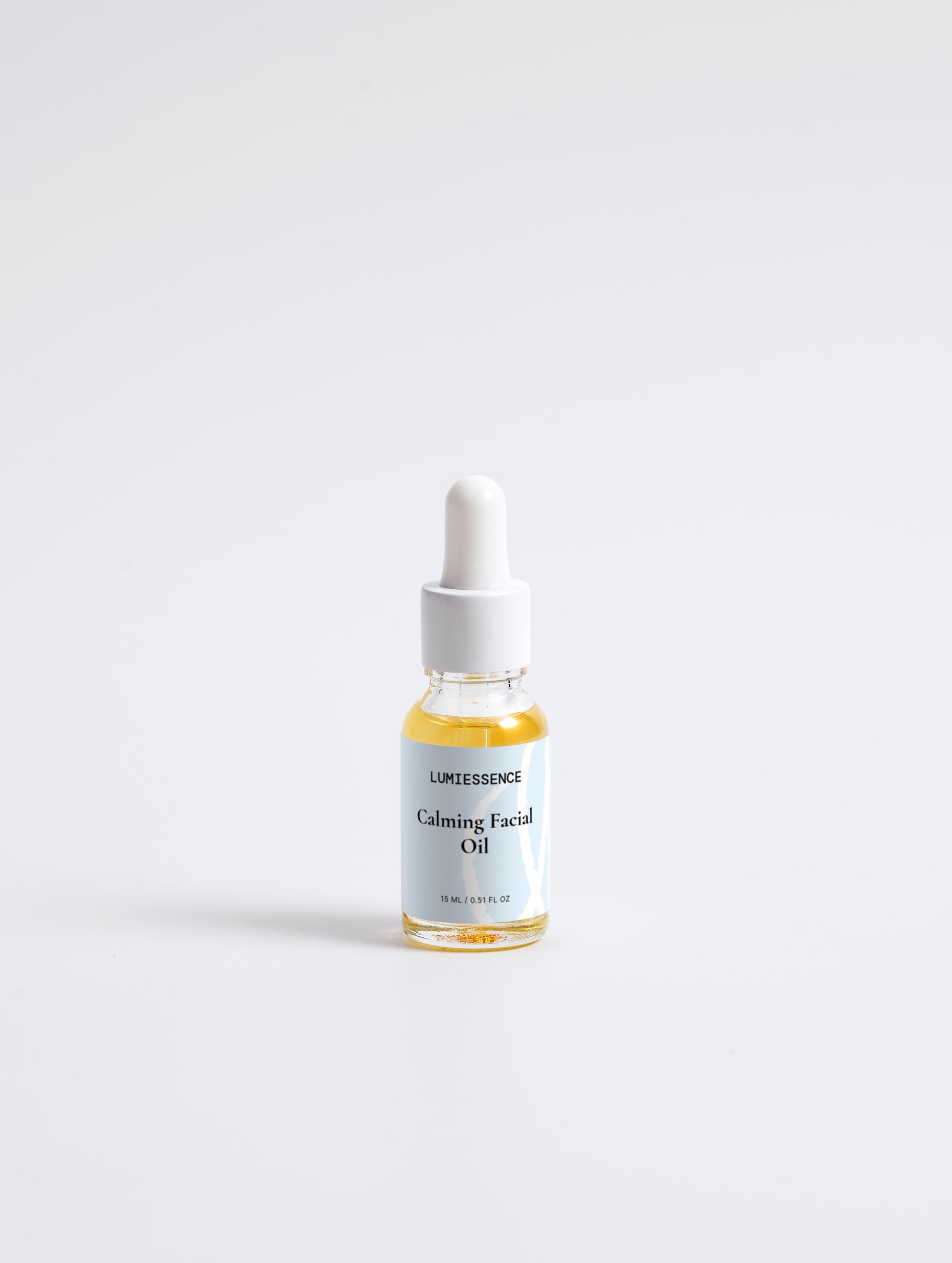 Close-up of Calming Facial Oil drops showcasing lightweight, nourishing texture.